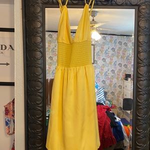 Strappy yellow bebe dress